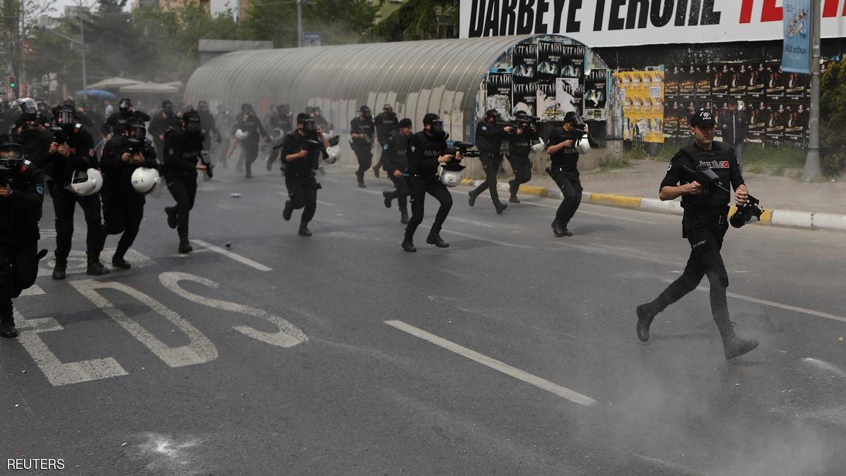 Turkish riot police launches tear gas grenades and fires rubber pellets at demonstrators during an attempt to defy a ban and march on Taksim Square to celebrate May Day in Istanbul