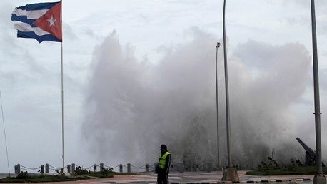 FILE PHOTO: A police officer stands on the seafront boulevard El Malecon ahead of the passing of Hurricane Irma, in Havana